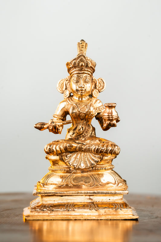 Bronze Annapoorani with a Pair of Arisi Kinnam