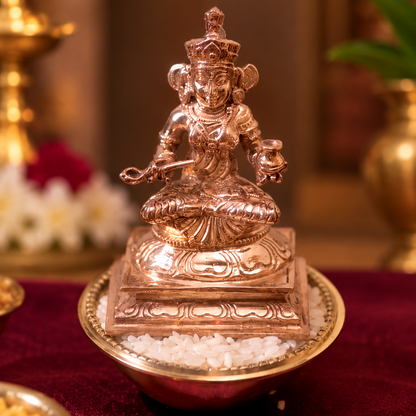 Bronze Annapoorani with a Pair of Arisi Kinnam